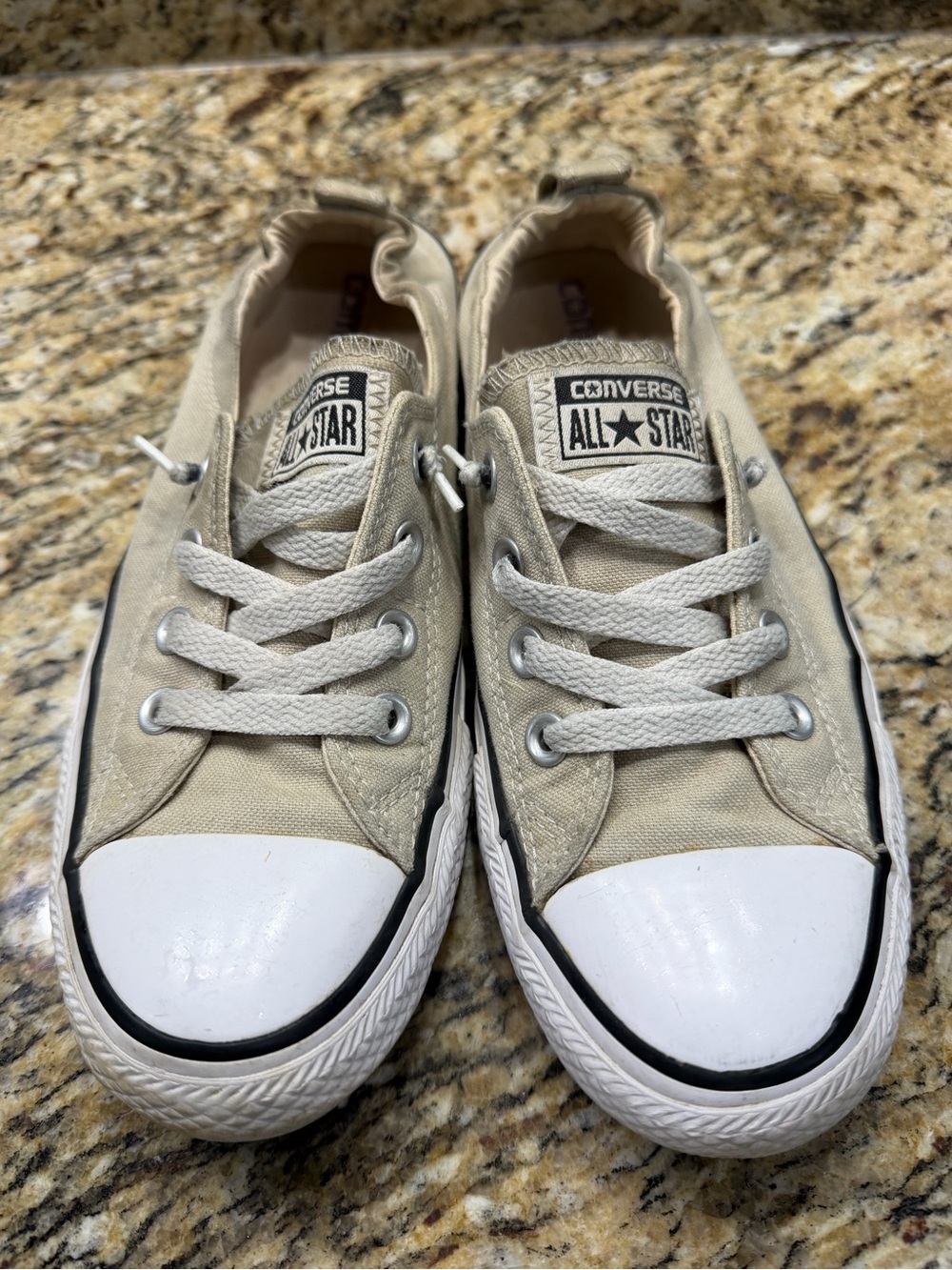 Beige converse shoreline